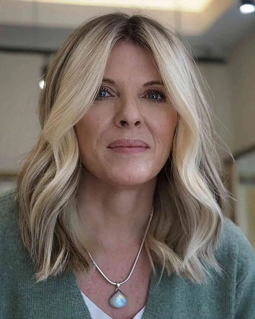 Mid-Length Cut with a Middle Part and Rooted Color for Women Over 40