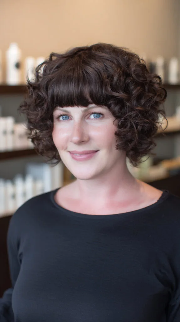 Playful Short Curly Cut with Defined Fringe