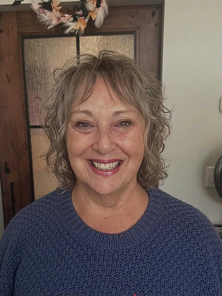 Short curly gray shag on older woman