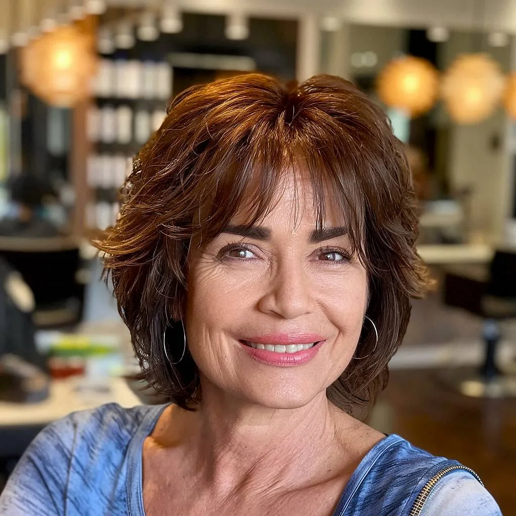Short shag mullet with wispy layers and curtain bangs