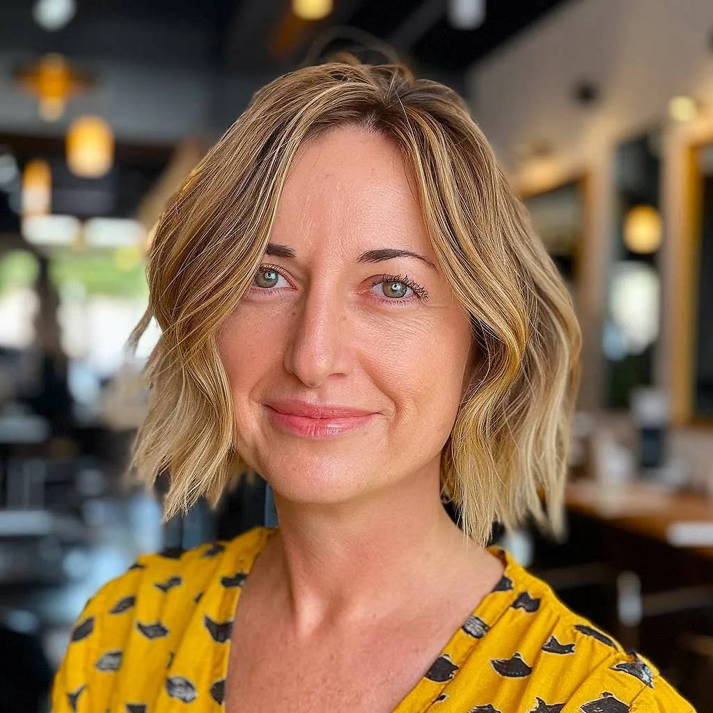 Short shaggy choppy bob with face-framing layers and subtle highlights