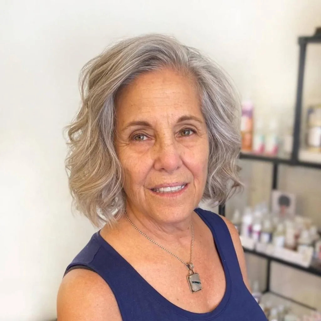 Short tousled wavy bob for older women with fine hair