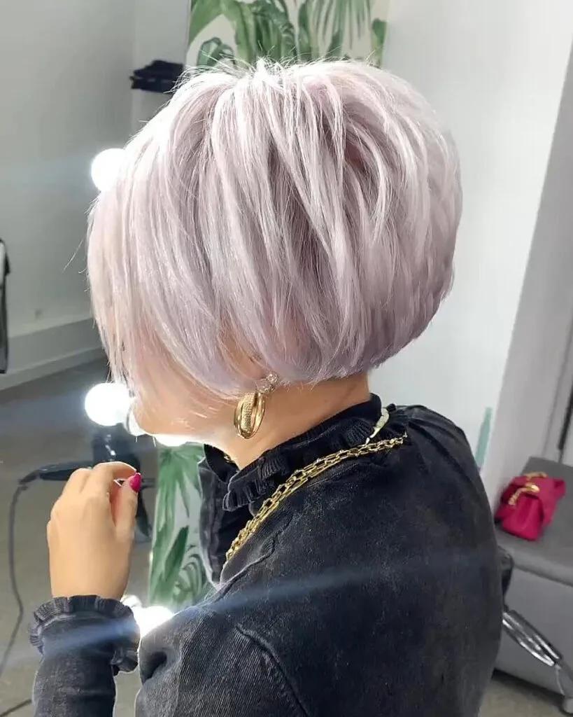 Stacked silver pixie bob for older ladies with fine thin hair, featuring layered back for added volume and fullness