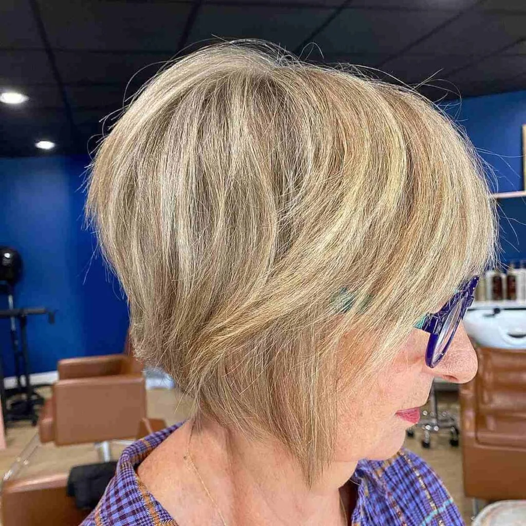 Textured Bob Featuring Blonde Lowlights for Women 60 and Over Wearing Glasses