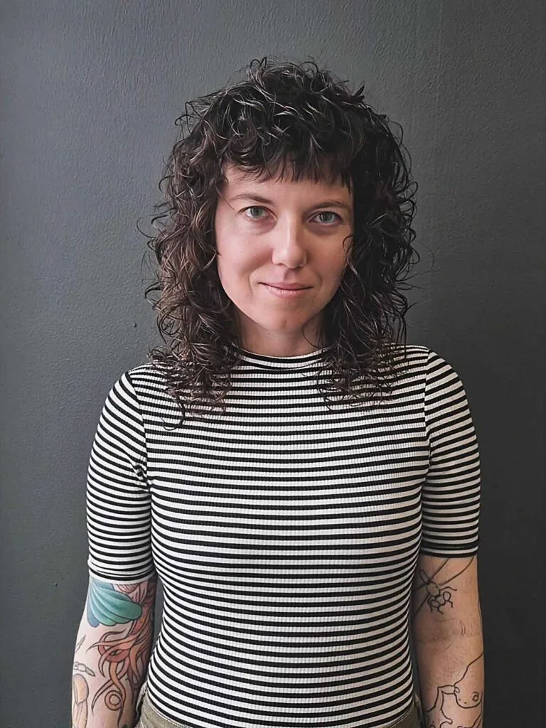 Tight spiral curly shag with center part