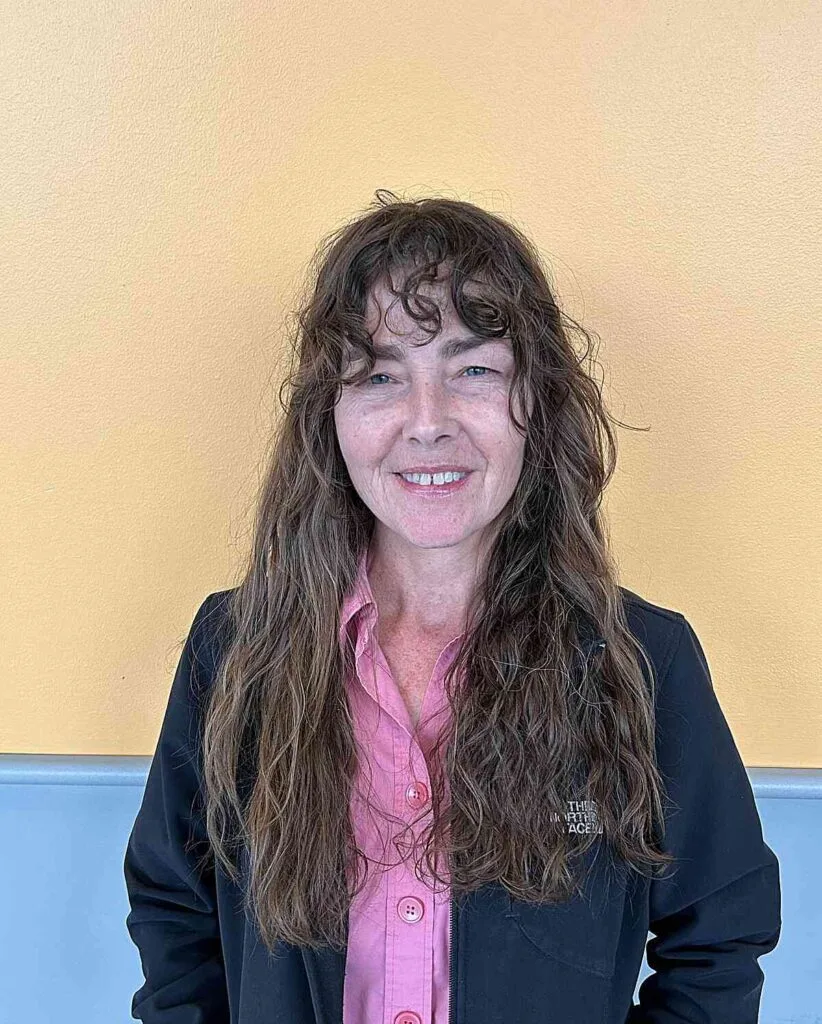 Tousled Long Haircut with Wispy Messy Bangs for Older Ladies Over 50