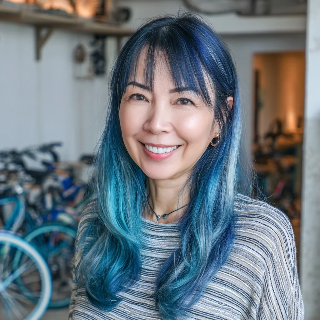 Vibrant Blue Ombre Curtain Bangs with Soft Layers