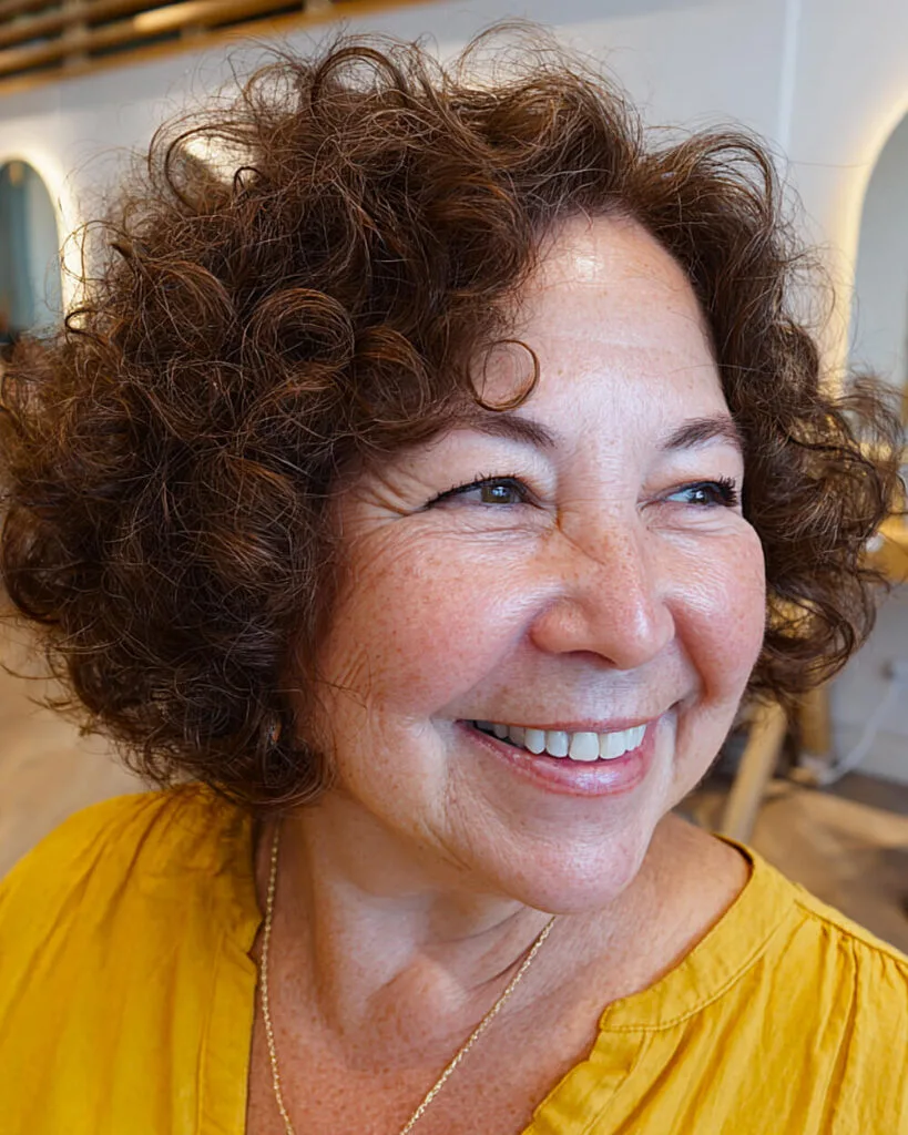 Voluminous chocolate curly bob for women over 60