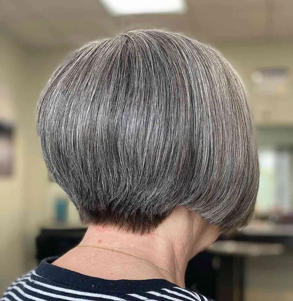 Wedge hairstyle for women over 60 wearing glasses