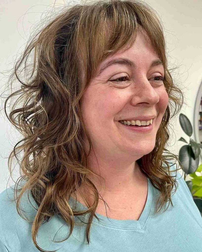 Chic Medium Shag Cut with Loose Curls for Mature Women