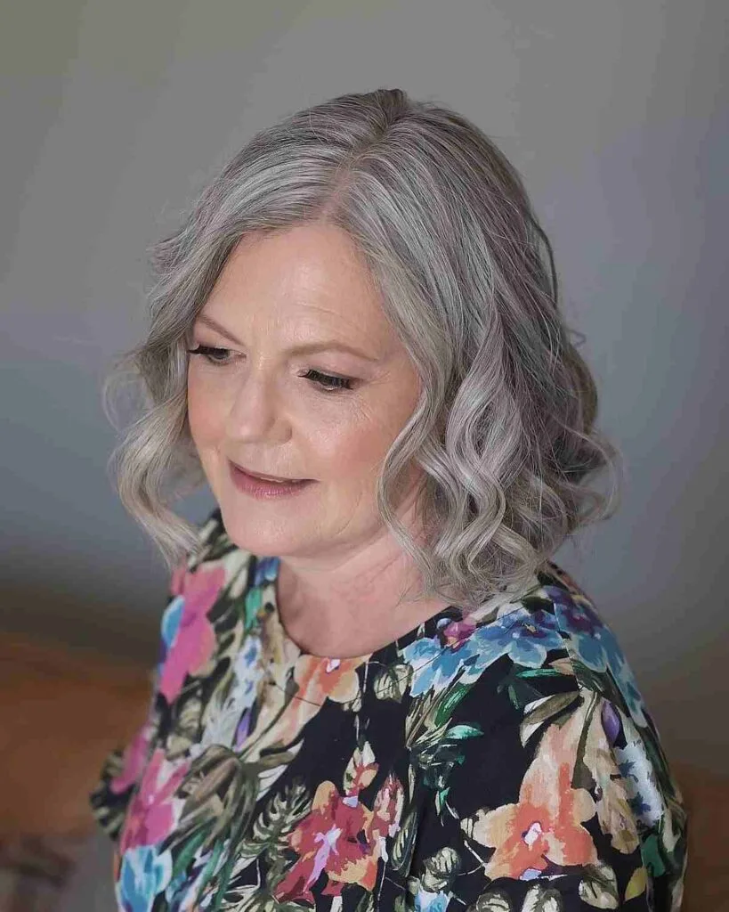 Chic Neck-Length Cut with Gentle Curls for a 50-Year-Old Lady
