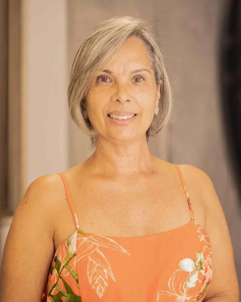 Chic Short Bobbed Hairstyle with Peek-a-Boo Bangs for a Fifty-Year-Old