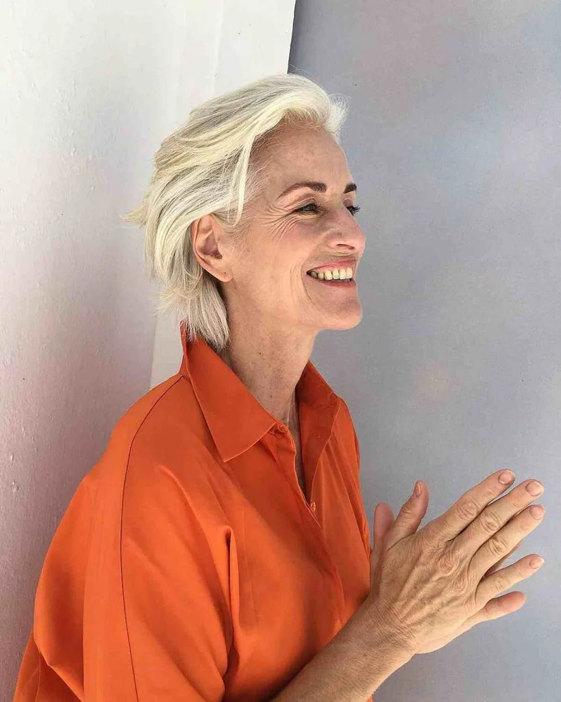 Chic Short Swept Back Feathered Hairstyle for Women 50 and Over
