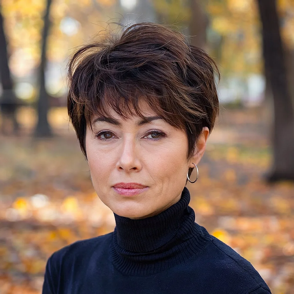 Choppy pixie shag for fine hair with wispy texture, great for women over 40 seeking volume
