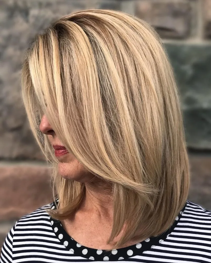 Dynamic Layered Blonde Cut with Soft Face-Framing Highlights
