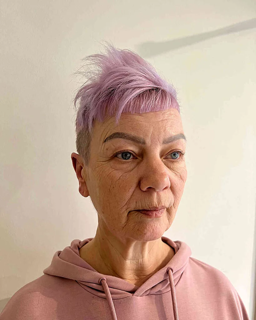 Edgy Pink Choppy Pixie with Volume on Top and Shaved Sides for 70-year-olds