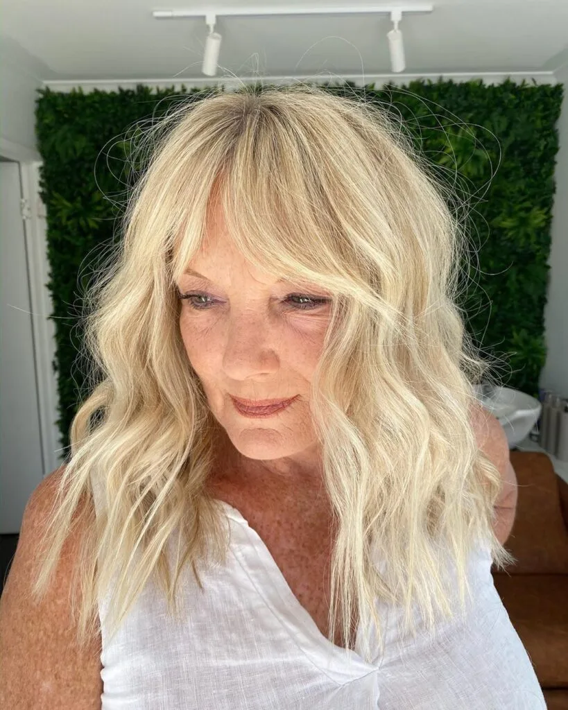 Flexible long hairstyle with curtain bangs for ladies in their 50s