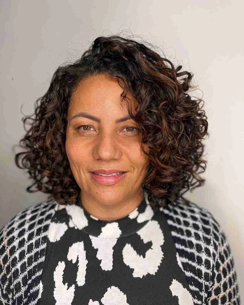 Full-Bodied Curls with a Side Partition for Ladies Over Fifty