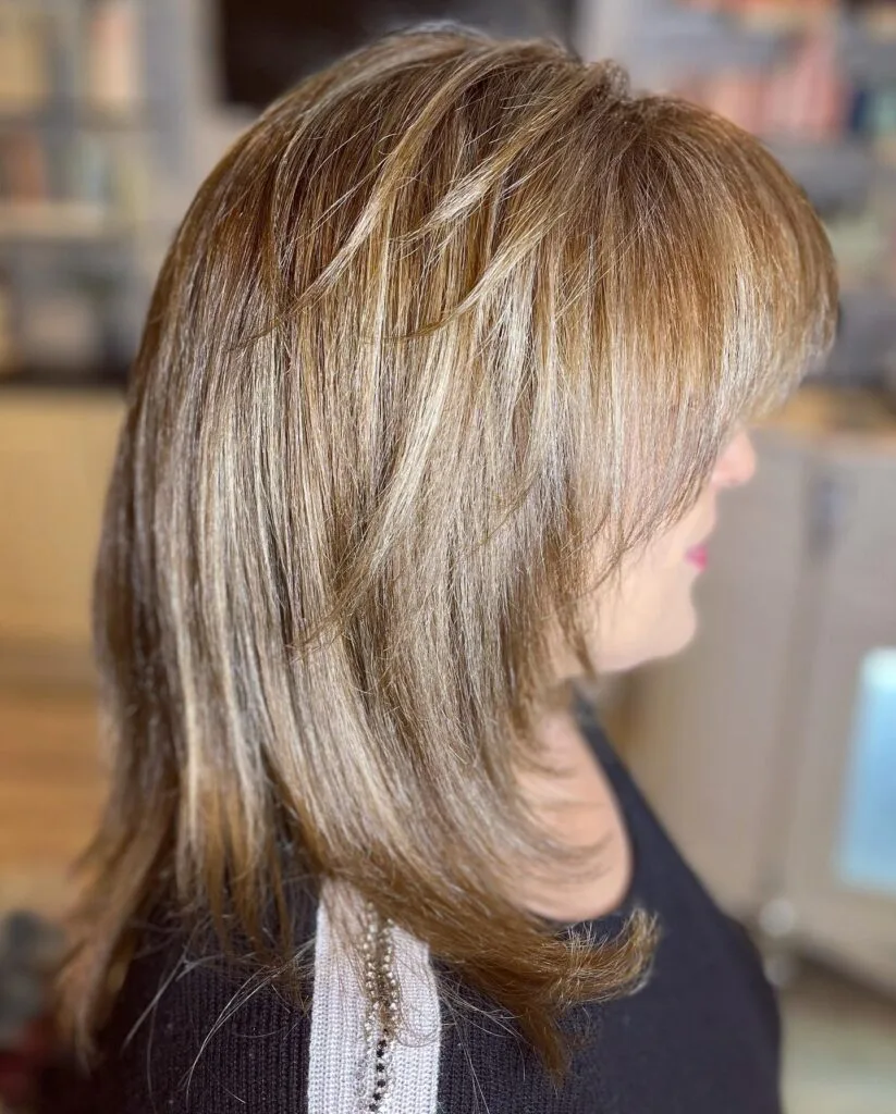 Layered Honey Blonde Cut with Subtle Face-Framing Highlights