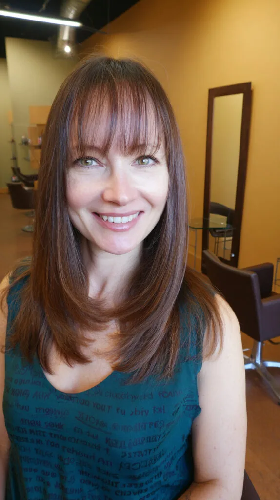 Long Sleek Cut with Wispy Bangs for a Fresh Look