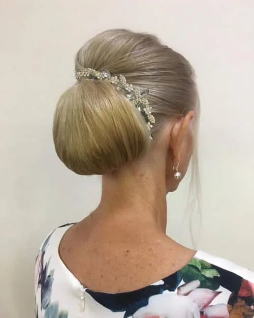 long stylish chignon hairstyle for woman over 50