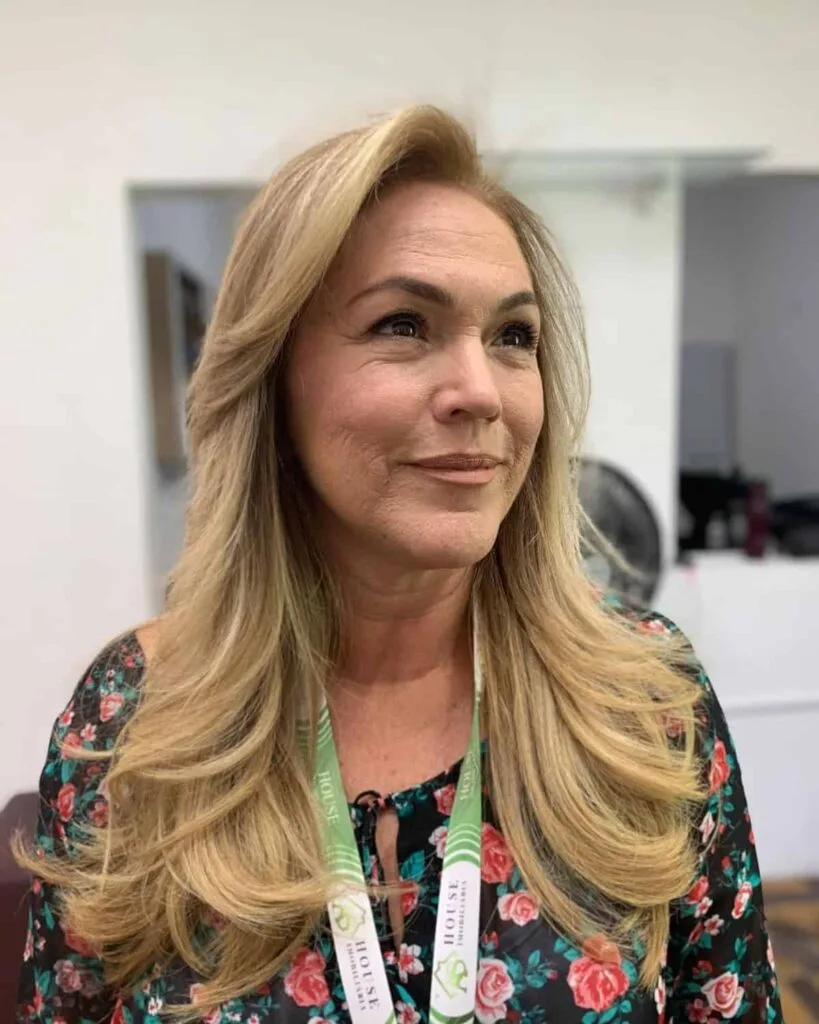 Long waves and blonde highlights for women in their 50s