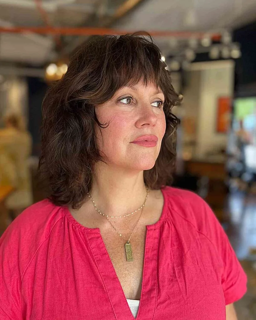 Medium Shaggy Layers with Subtle Waves on Older Women Over 40