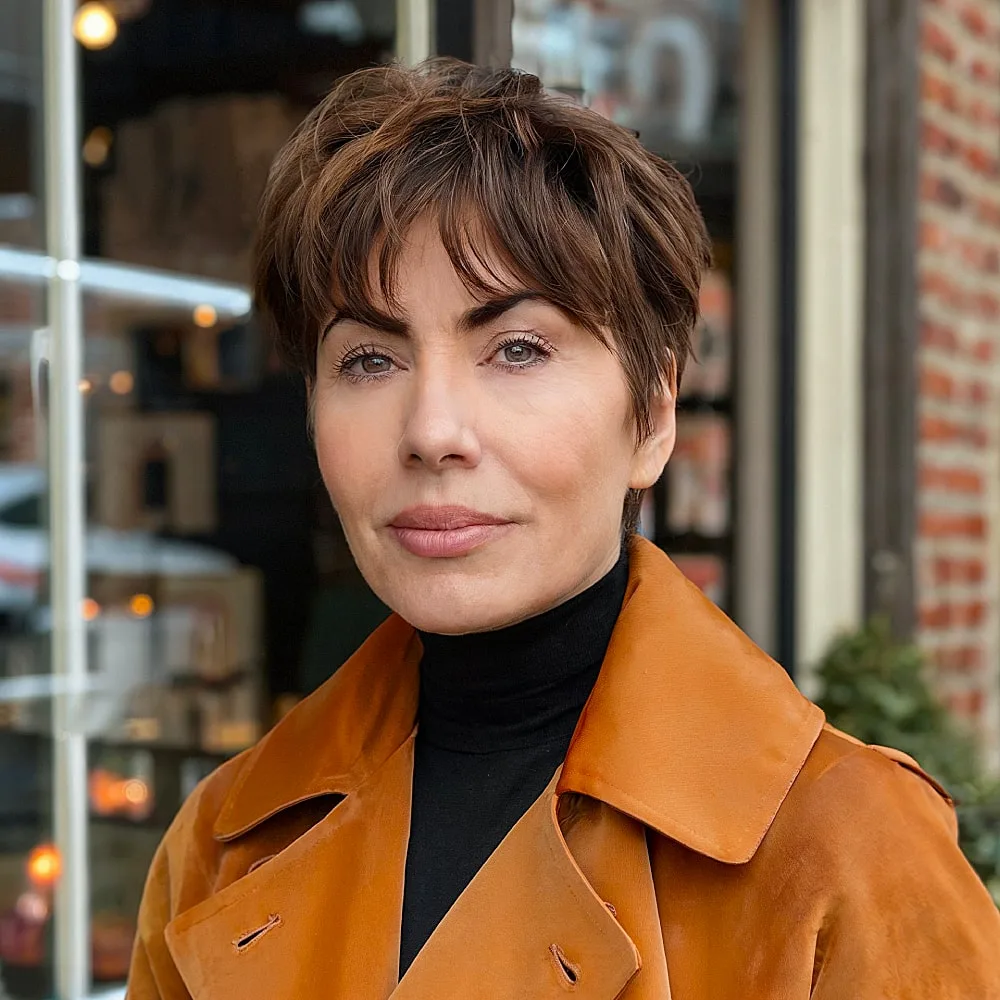 Pixie shag hairstyle with curtain bangs and layered texture for women over 40 with volume