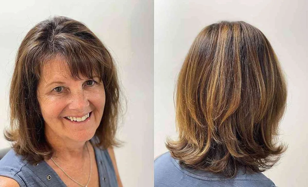 Radiant Medium Layered Hairstyle with Side Bangs for Women Over 50