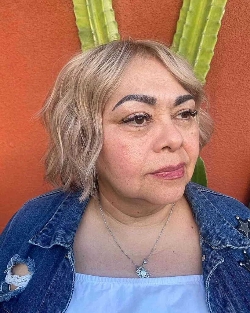 Short Hair with Lowlights and Wispy Ends for 50-year-olds with Round Face Shapes