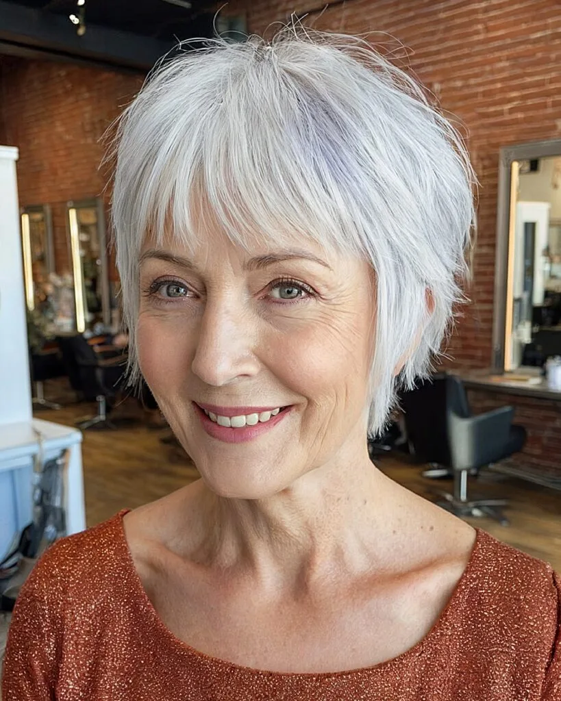 Short textured crop with layered bangs for women over 70 with silver fine hair