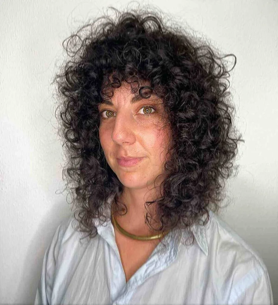 Shoulder-Length Curly Shag for a Lady in Her 40s