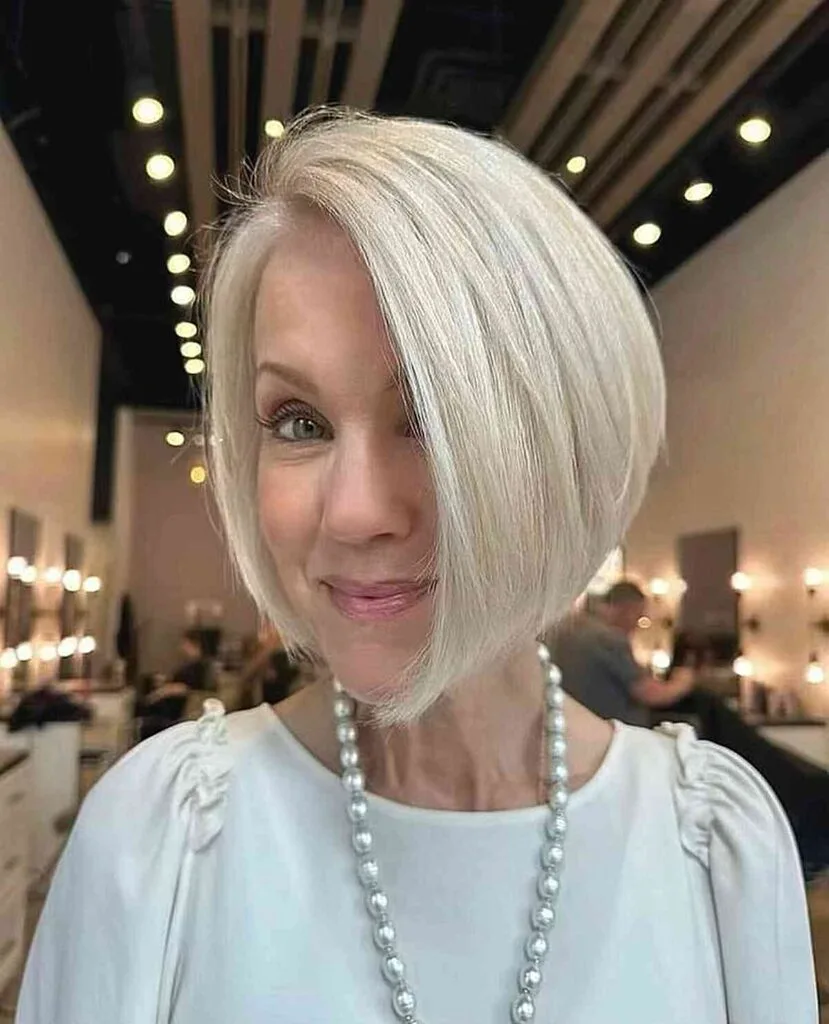 side parted angled bob for woman in her fifties with round face