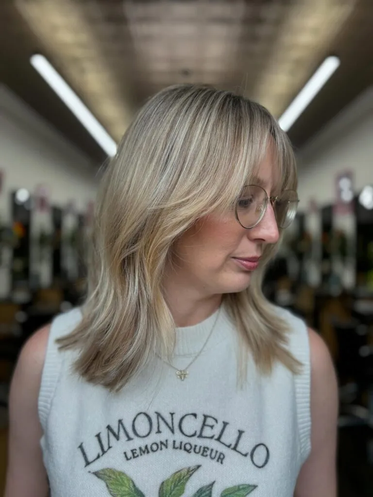 Soft Layered Blonde Cut with Gentle Face-Framing Highlights