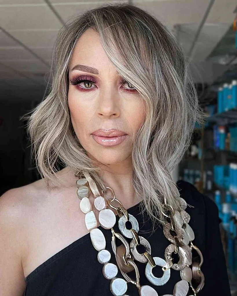 Stylish Grey Balayage on a Mid-Length Hairstyle for Women Aged 50