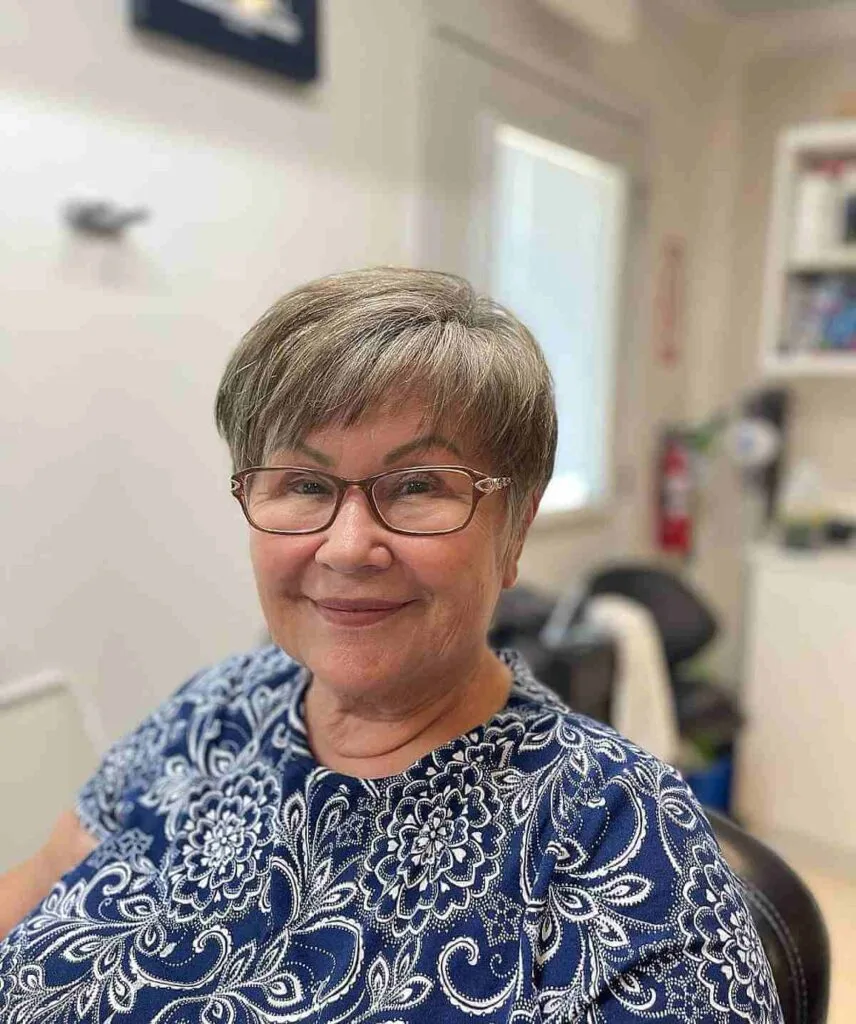 Stylish Short Gray Hair with Micro Bangs for a Woman in Her 50s