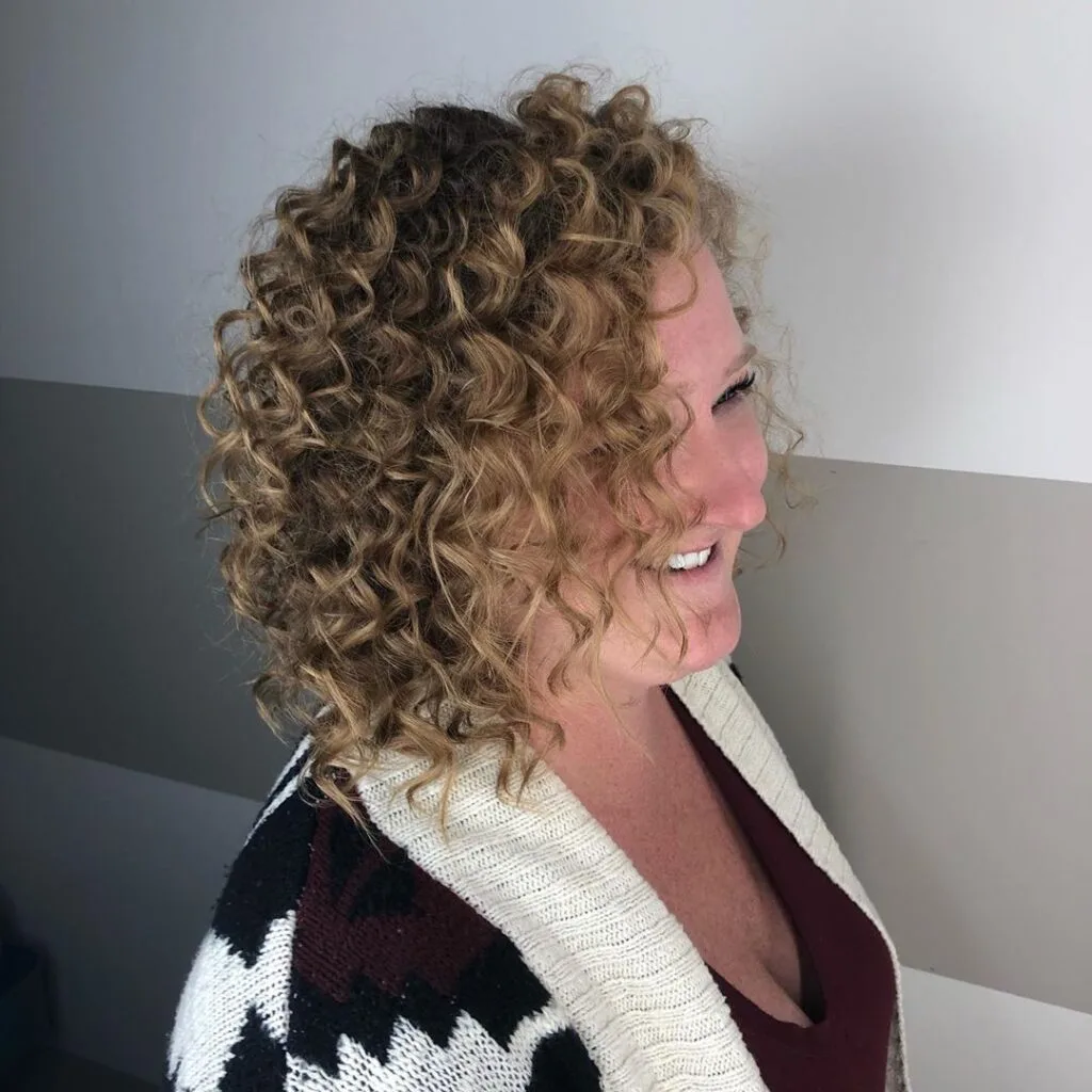 Textured Short Hairstyle for Curly Locks for women 50+ with round face
