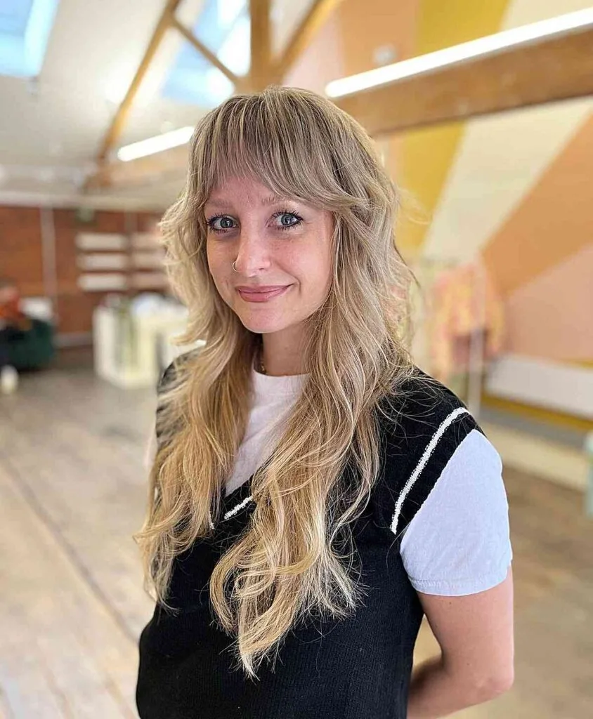 Wavy Long Hair with Shaggy Layers and Bangs for Women Over 40
